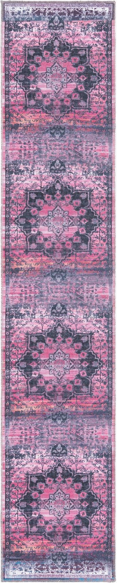 A 10 ft runner rug in a vintage traditional style with a medallion pattern, featuring distressed pinks and dark gray tones.