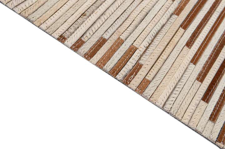 4' 11 x 8' 2 Cowhide - Patchwork Rug