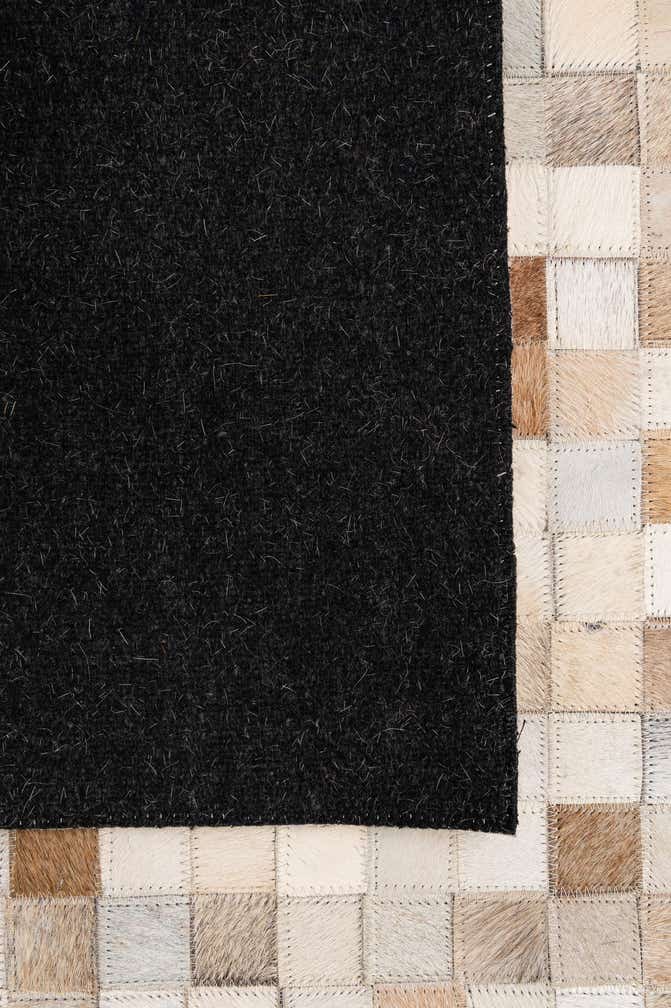 4' 11 x 8' 1 Cowhide - Patchwork Rug