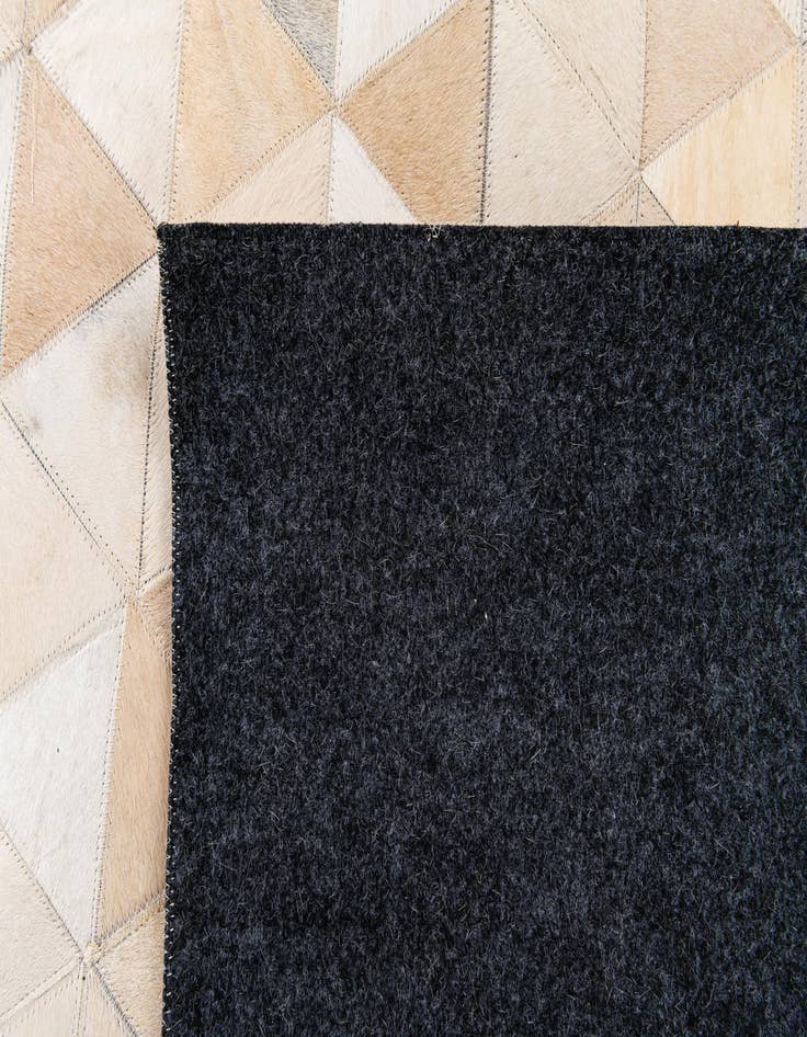 Detail image of 5' 1 x 8' 1 Cowhide Stocks Rug