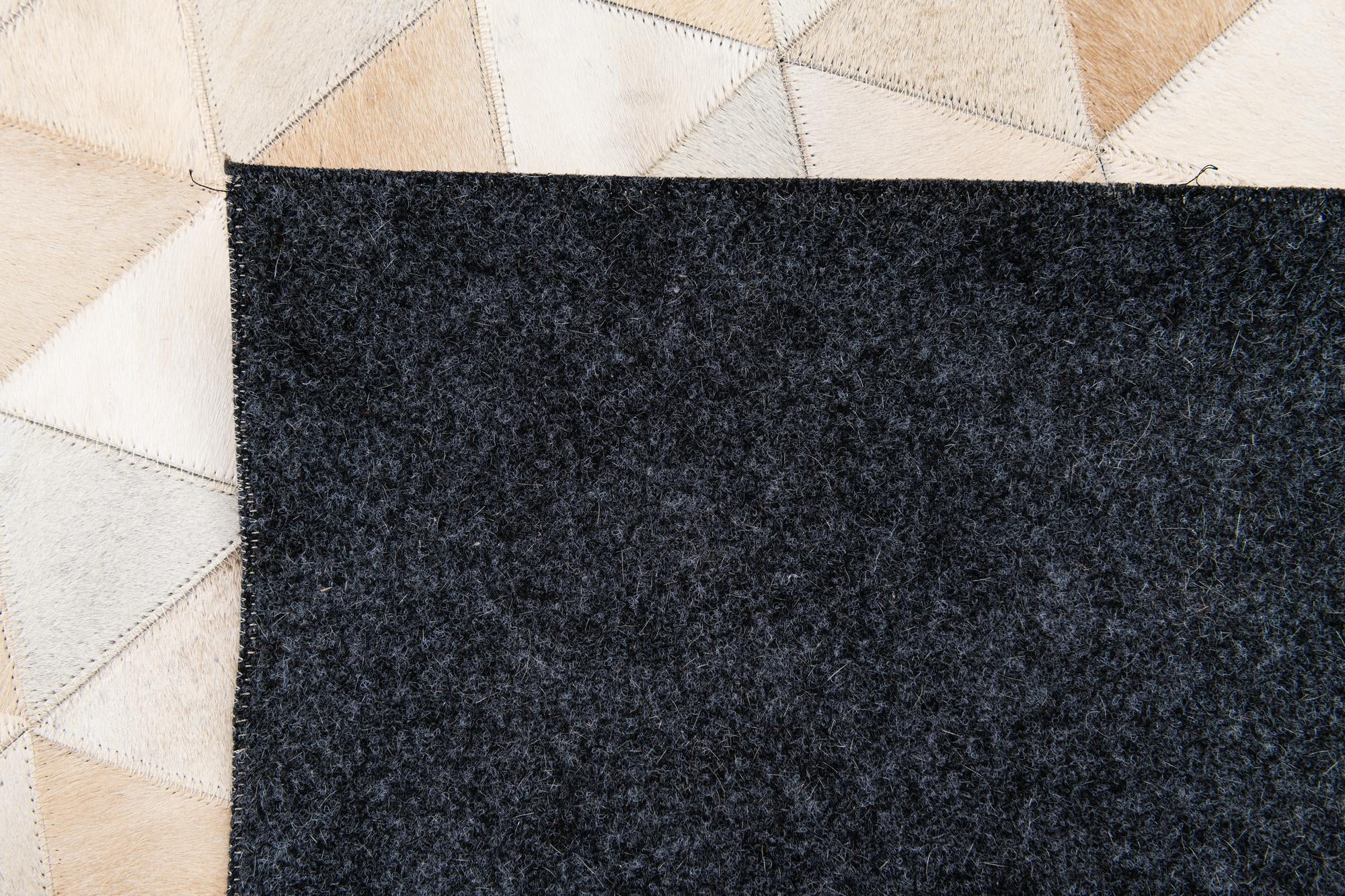 5' 2 x 8' 1 Cowhide Stocks Rug