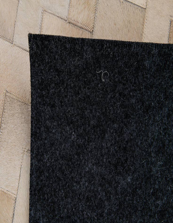 Detail image of 4' 1 x 5' 10 Cowhide Stocks Rug