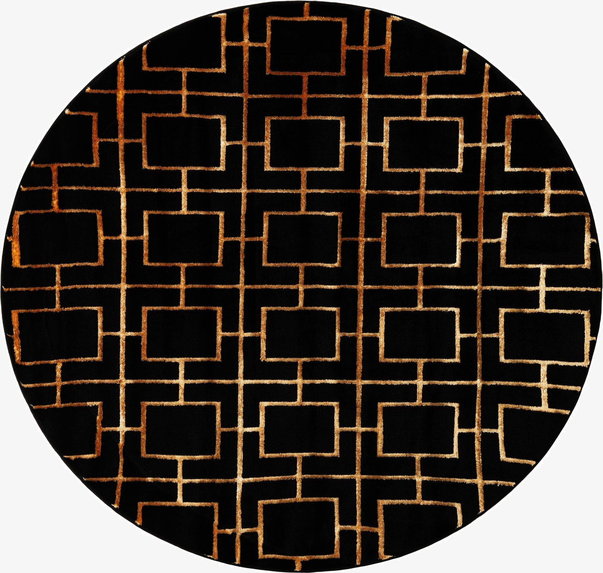 A round black area rug with a modern gold geometric trellis pattern, featuring interconnected rectangles.