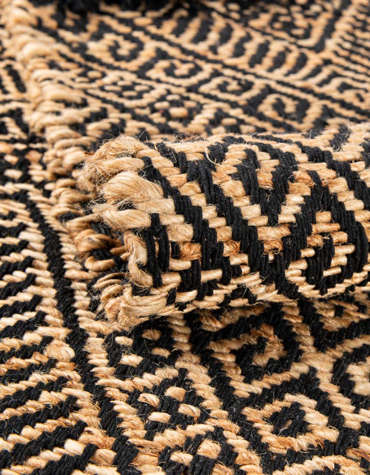 Detail image of Custom Black and Natural Handmade Braided Jute Rug