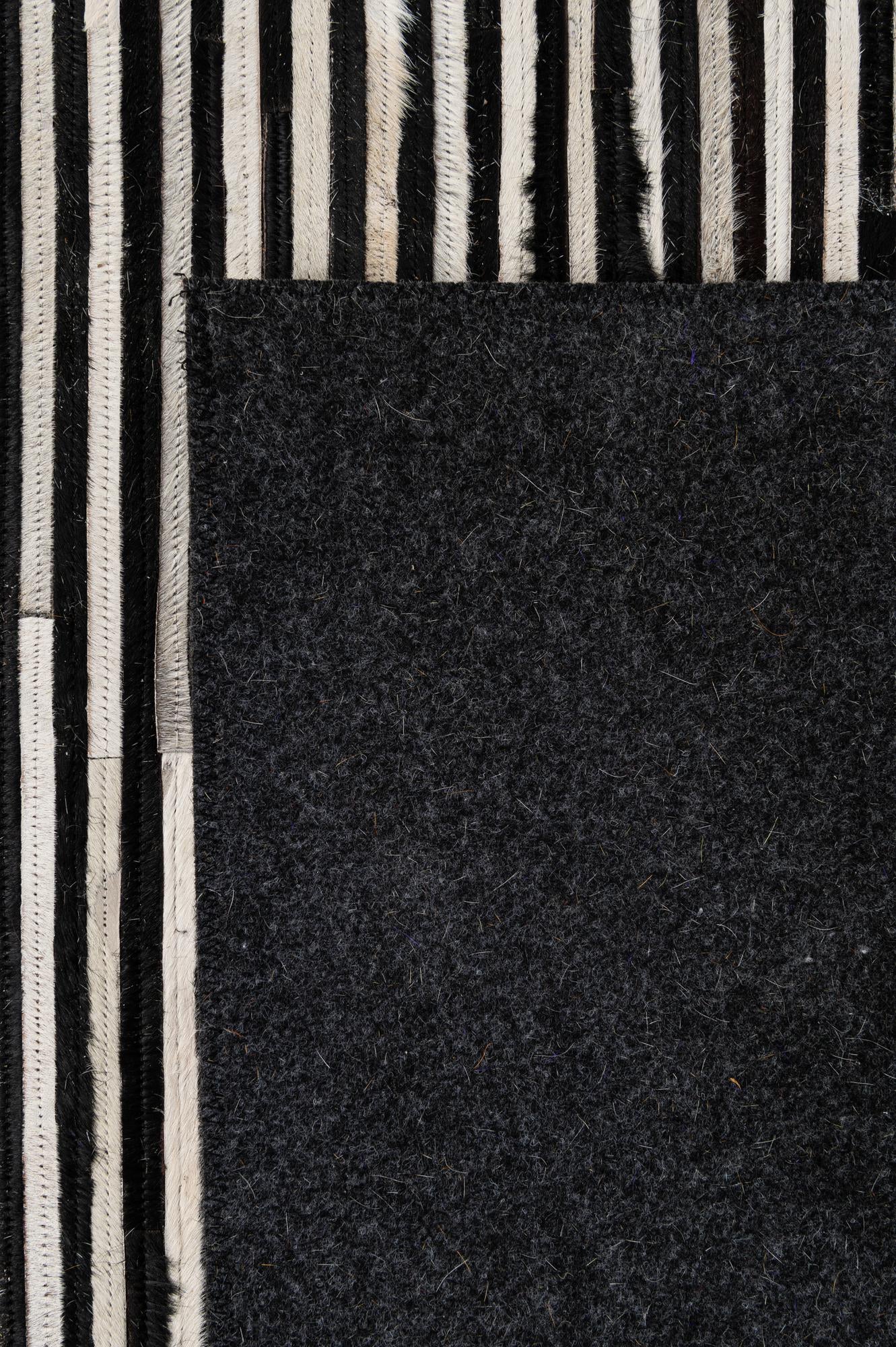 5' 1 x 7' 11 Cowhide - Patchwork Rug