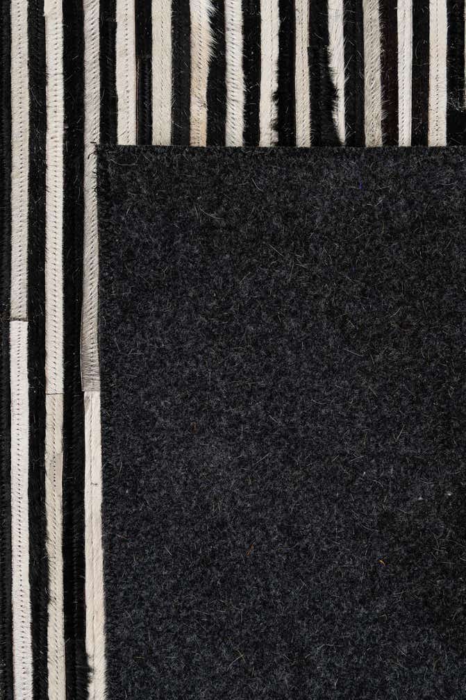5' 1 x 7' 11 Cowhide - Patchwork Rug
