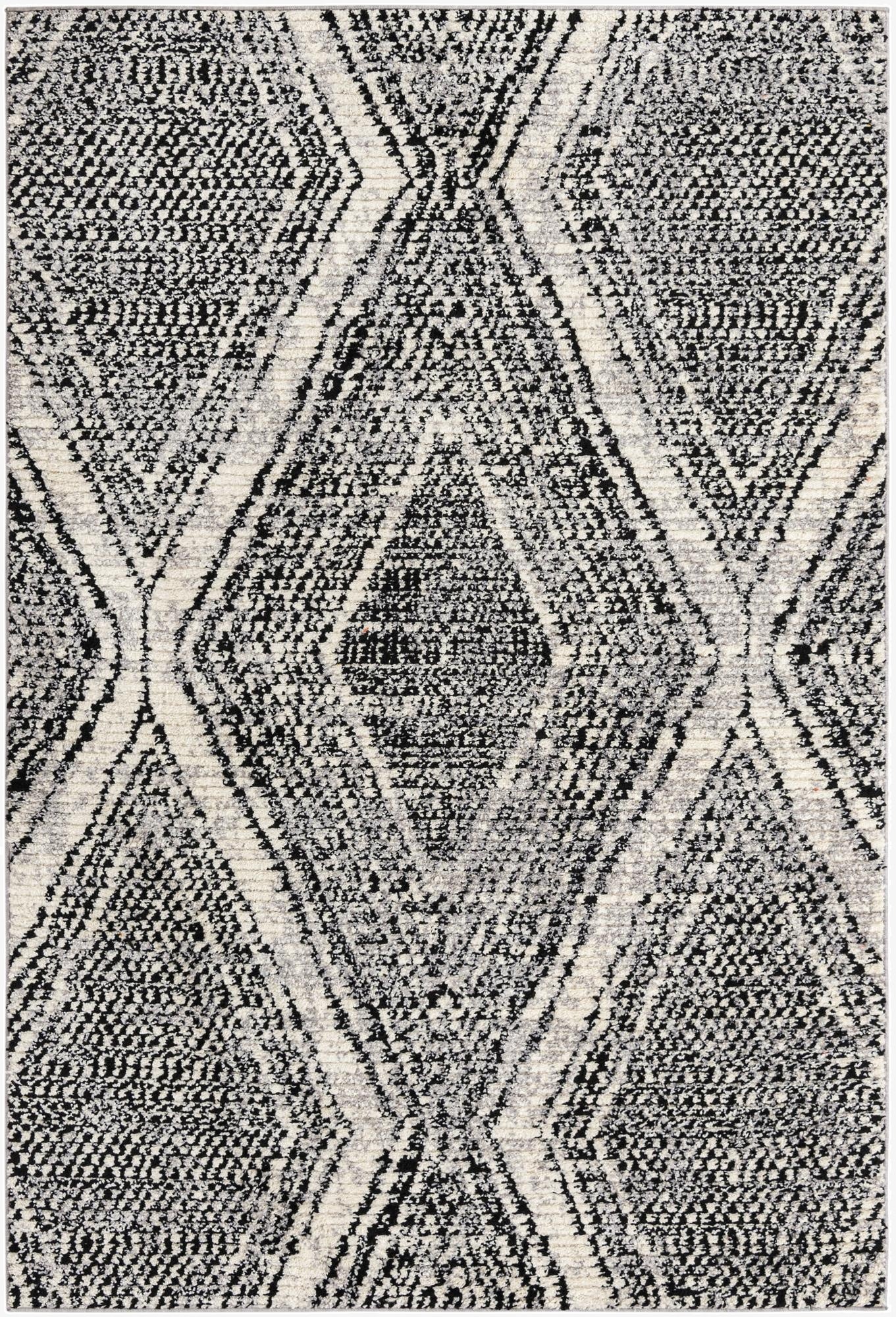 A 6x9 rectangular Tagine rug featuring a bold black and white Southwestern diamond pattern with a textured pile.