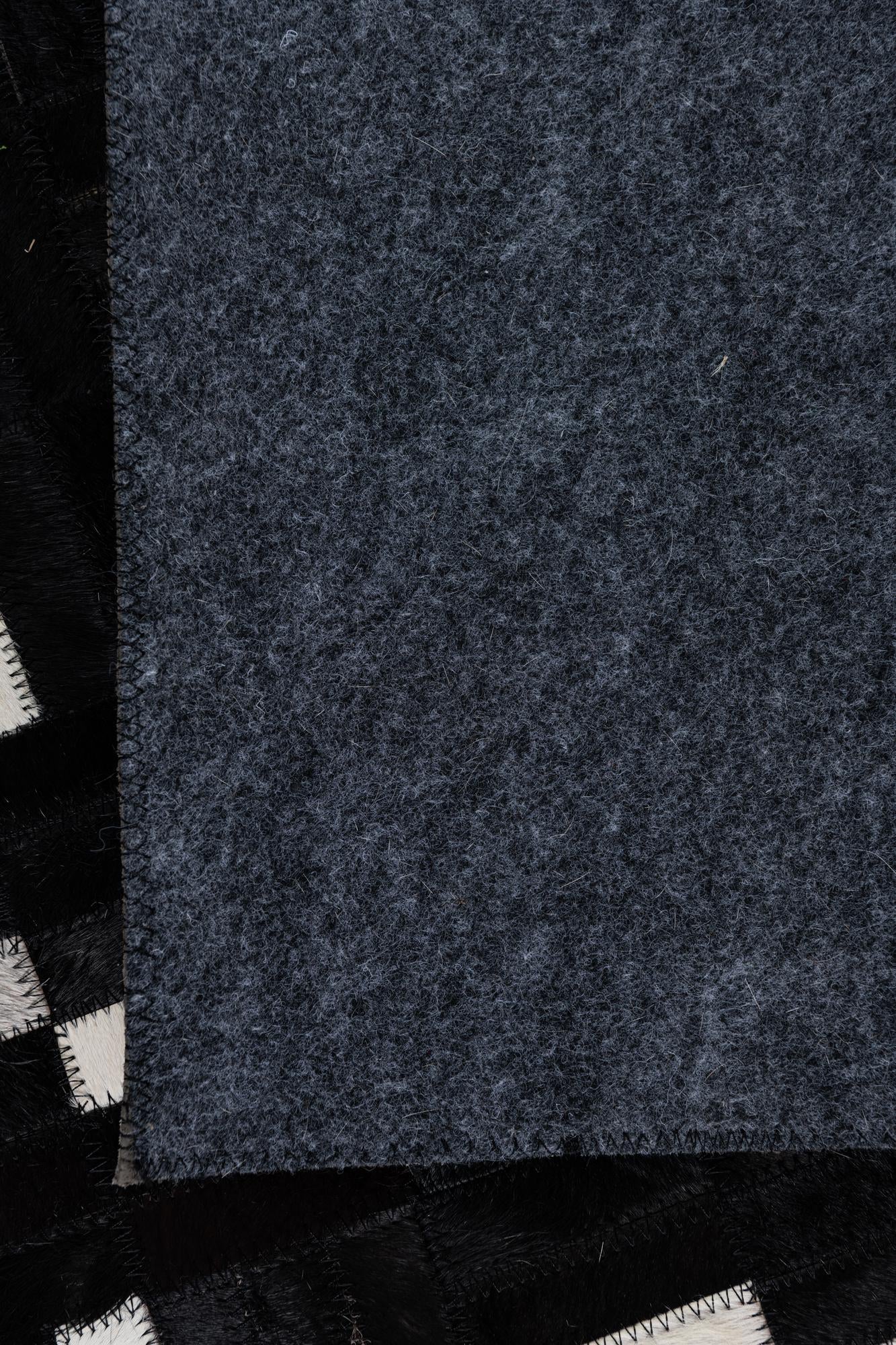 5' 2 x 8' 2 Cowhide Leather Rug