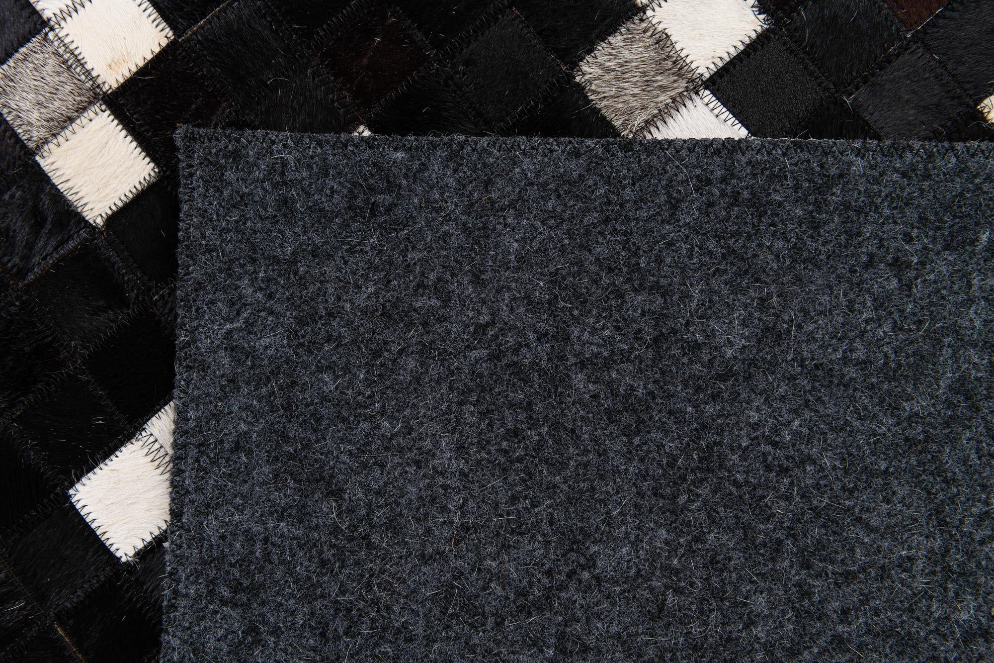 7' 11 x 9' 10 Cowhide Stocks Rug