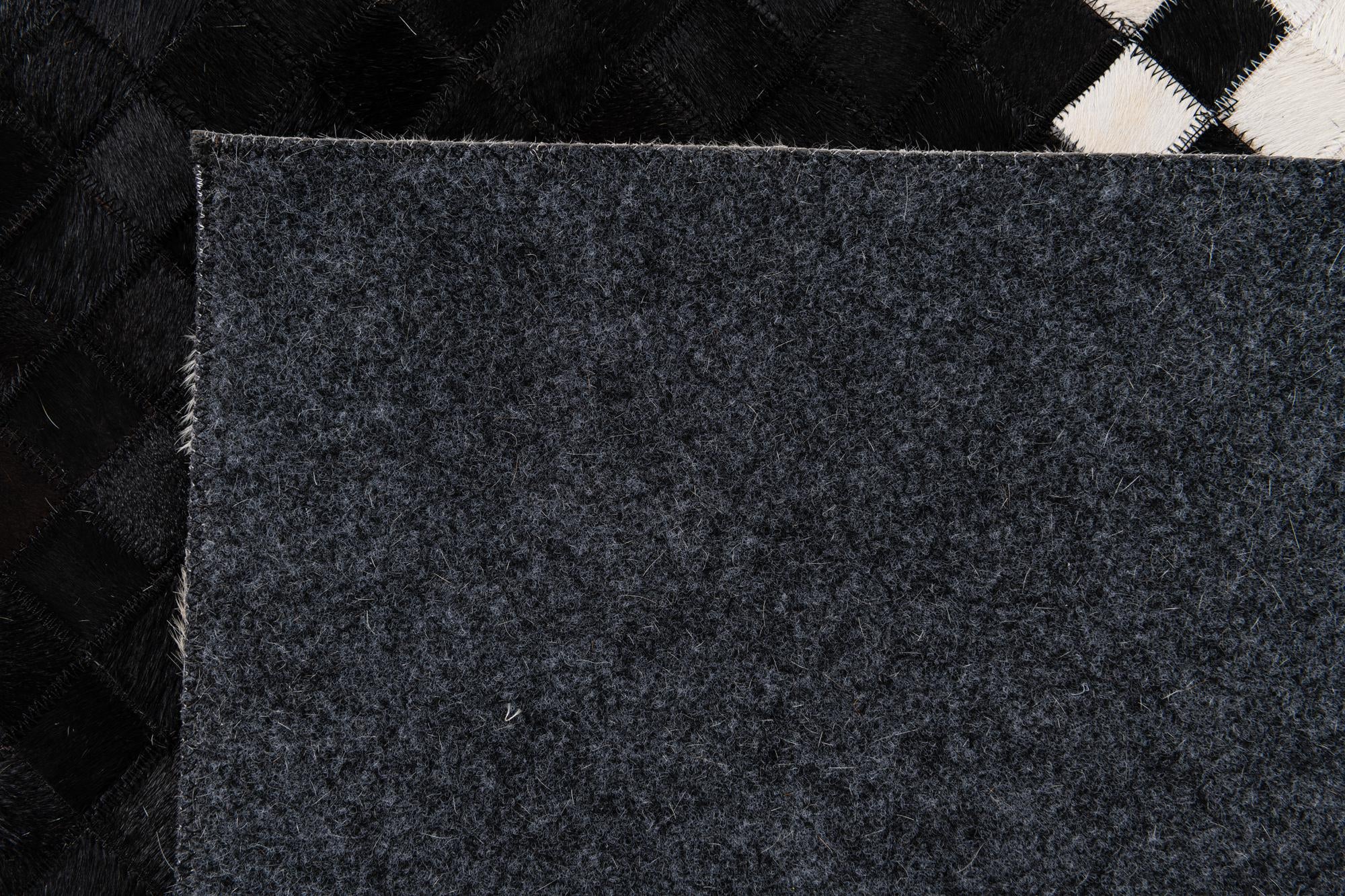 8' 1 x 9' 11 Cowhide Stocks Rug