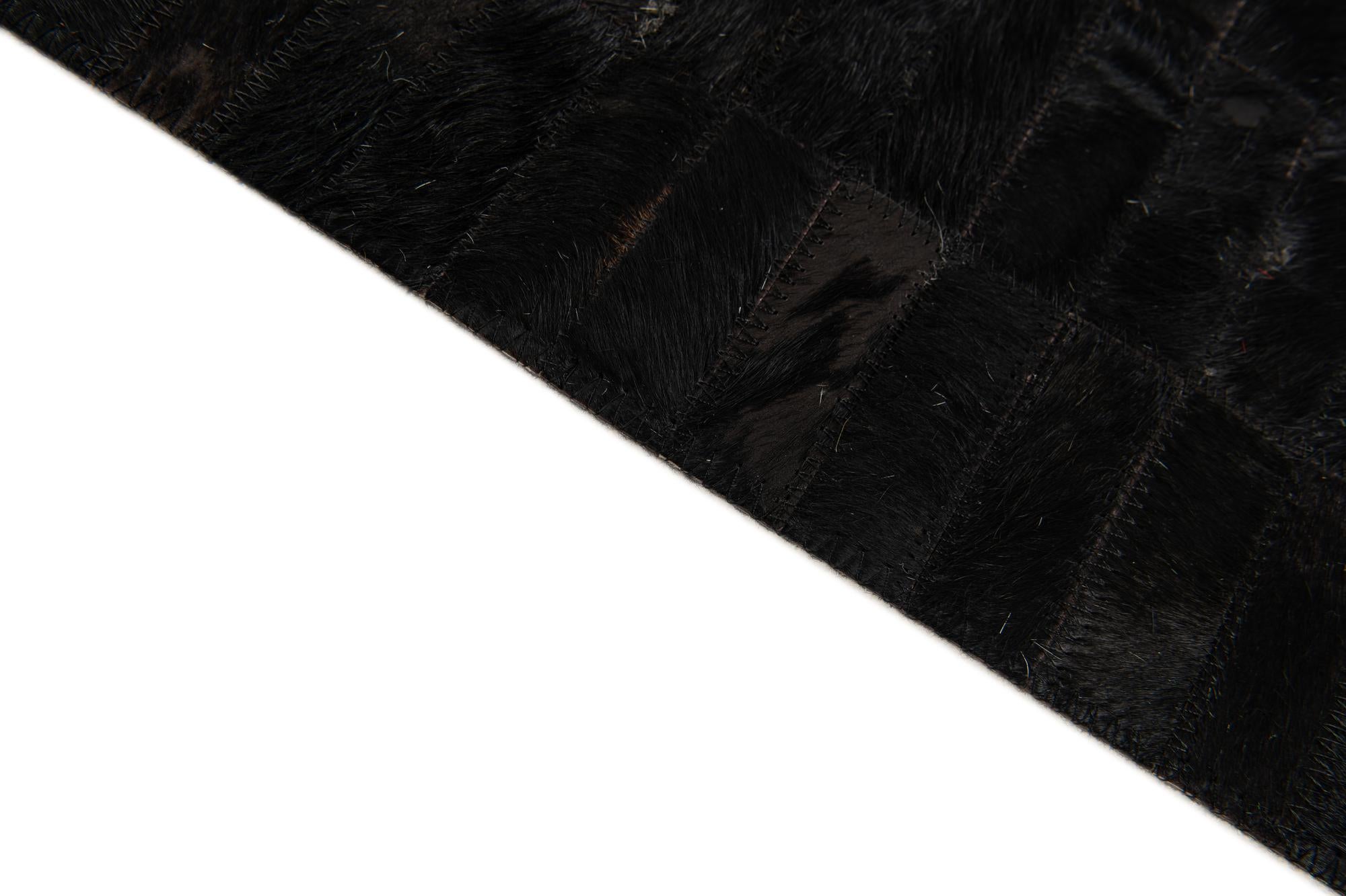 5' 11 x 9' Cowhide Stocks Rug