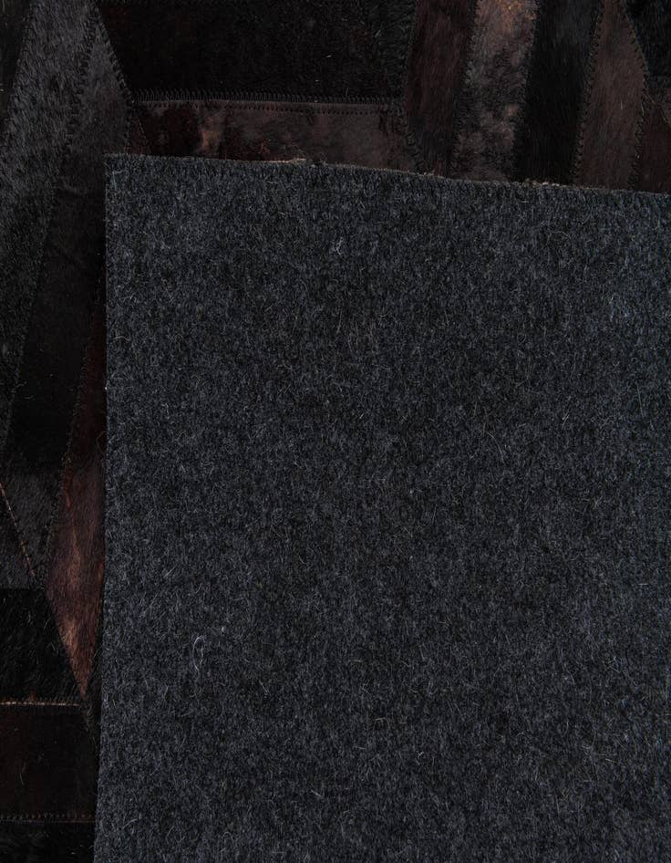 Detail image of 6' x 8' 11 Cowhide Stocks Rug