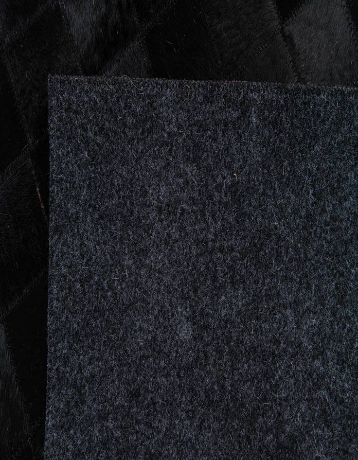 Detail image of 4' 11 x 7' 11 Cowhide Stocks Rug