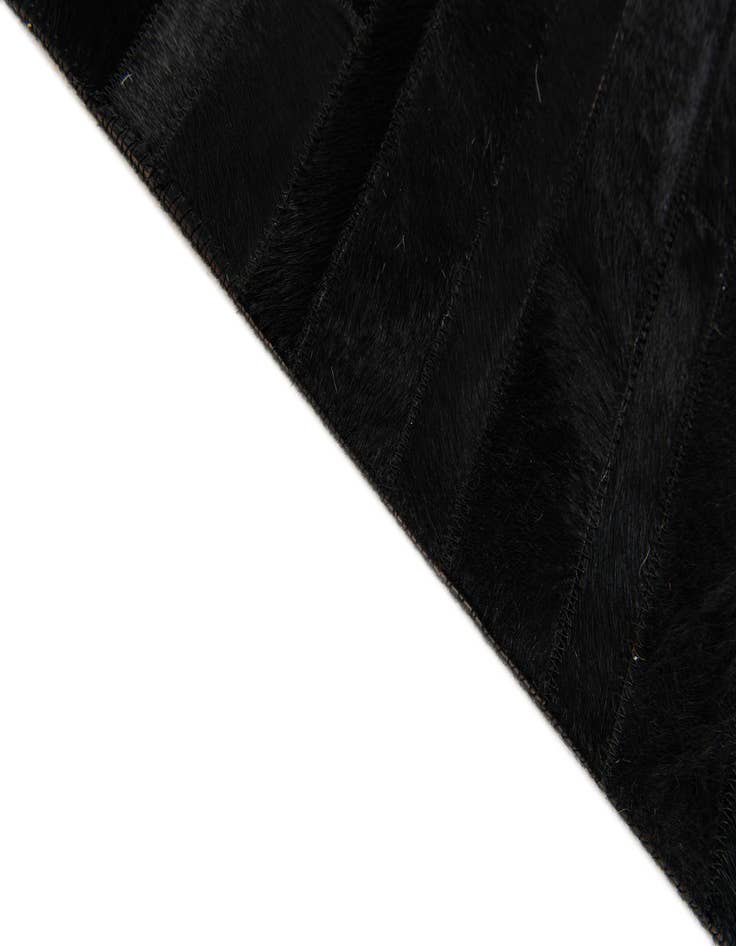 Detail image of 5' x 7' 11 Cowhide Stocks Rug