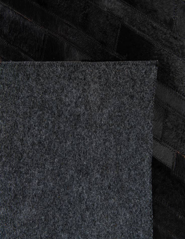 Detail image of 5' x 7' 11 Cowhide Stocks Rug