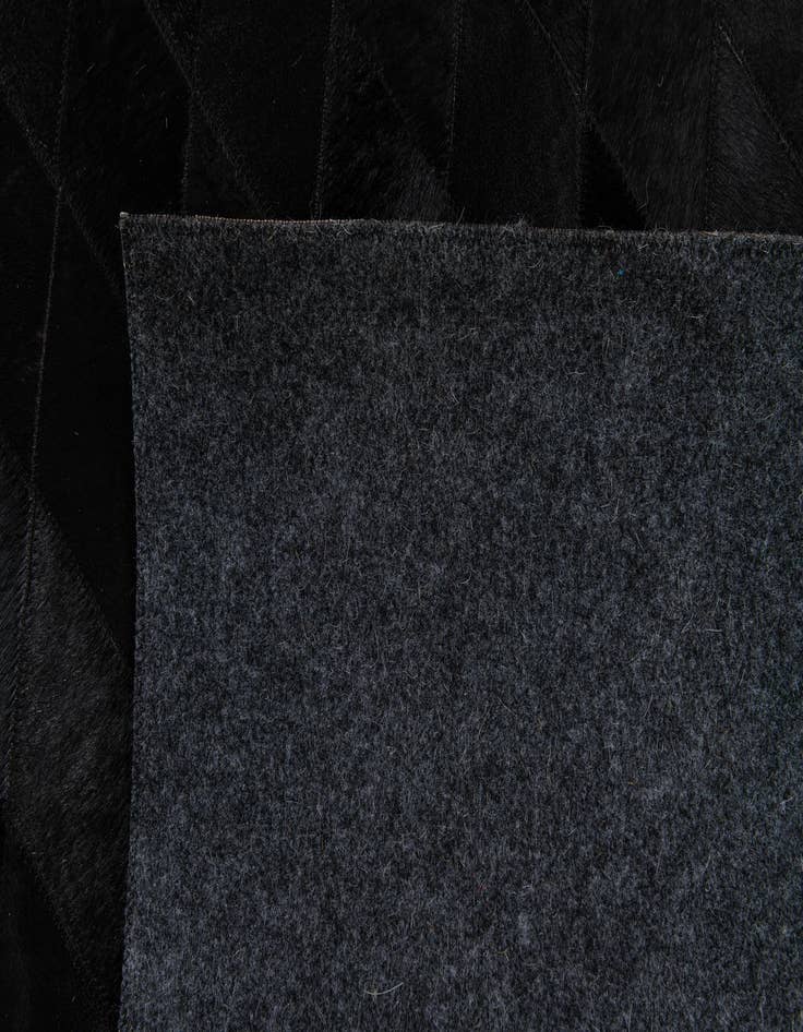 Detail image of 5' 1 x 8' Cowhide Stocks Rug