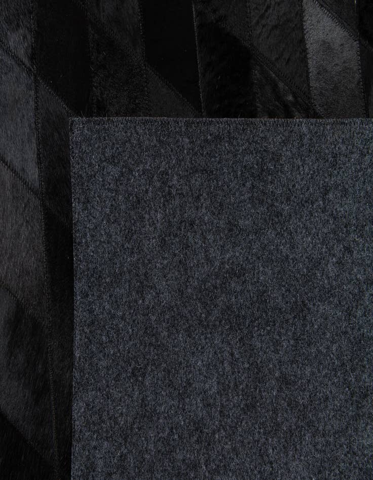 Detail image of 5' 2 x 8' Cowhide Stocks Rug