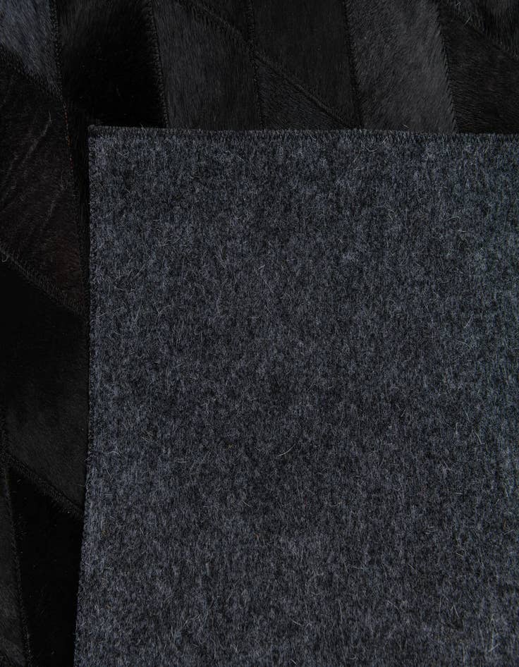 Detail image of 5' 2 x 8' Cowhide Stocks Rug