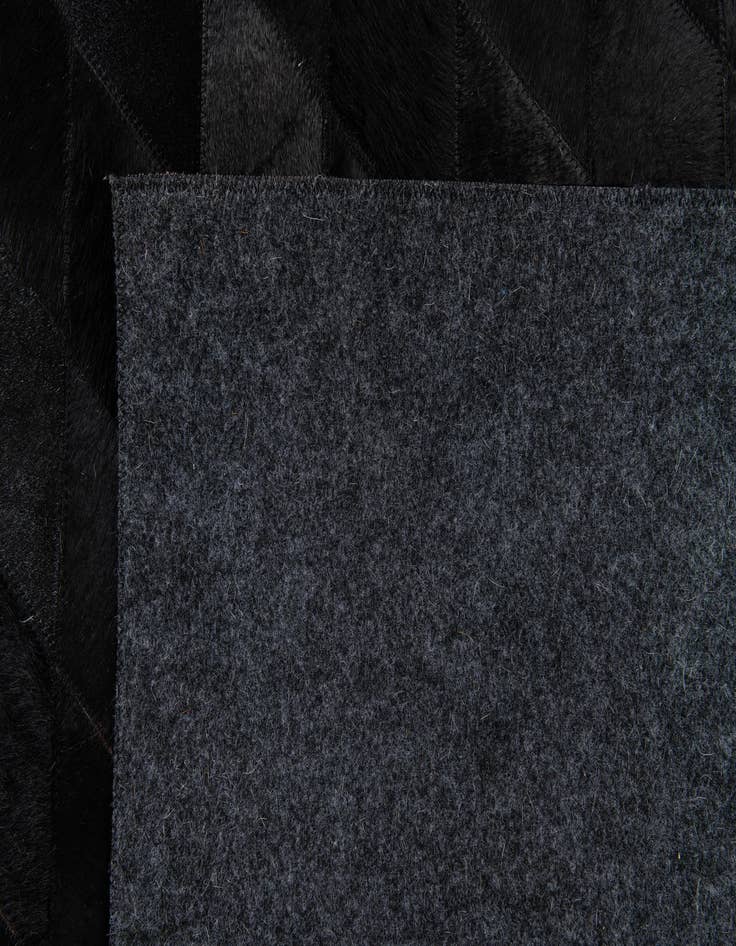 Detail image of 5' 1 x 8' Cowhide Stocks Rug