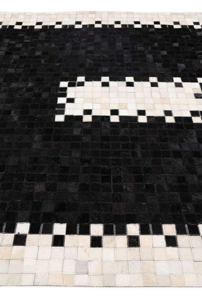 5' 2 x 8' 1 Cowhide Stocks Rug