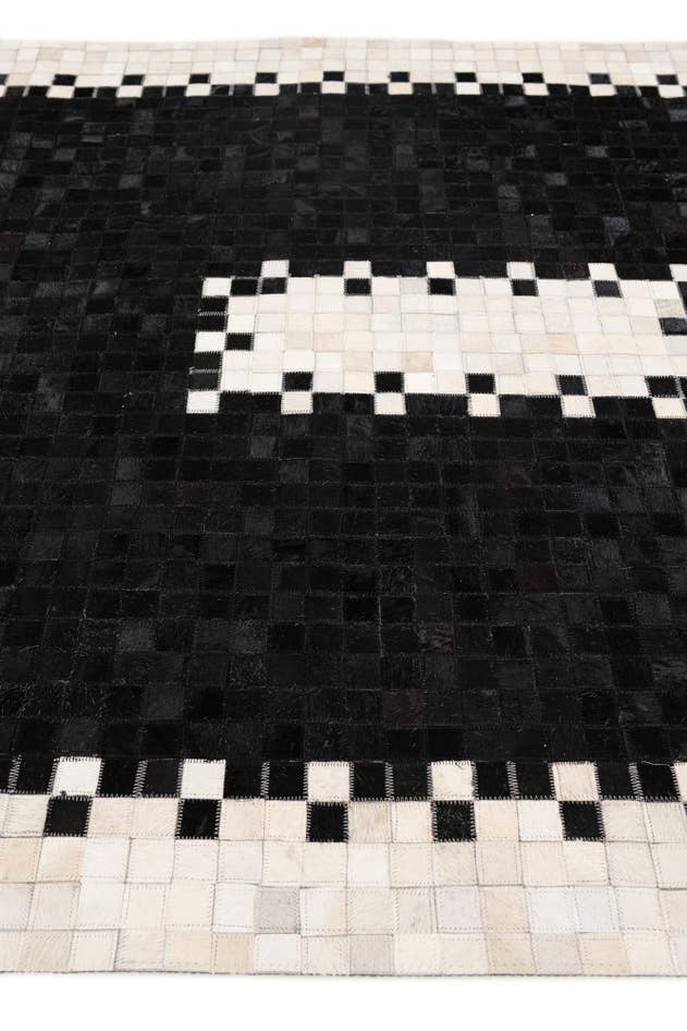 Detail image of 5' 2 x 8' 1 Cowhide Stocks Rug