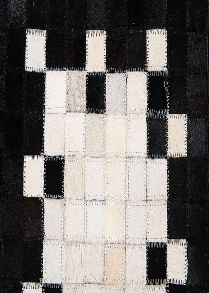 5' 2 x 8' 1 Cowhide Stocks Rug