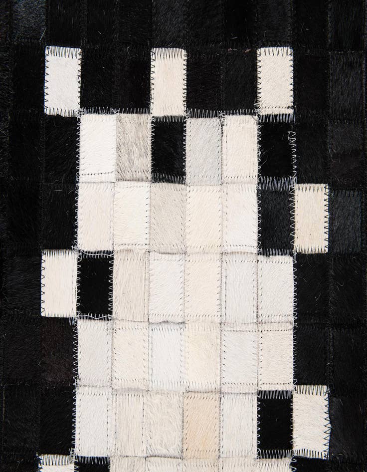 Detail image of 5' 2 x 8' 1 Cowhide Stocks Rug