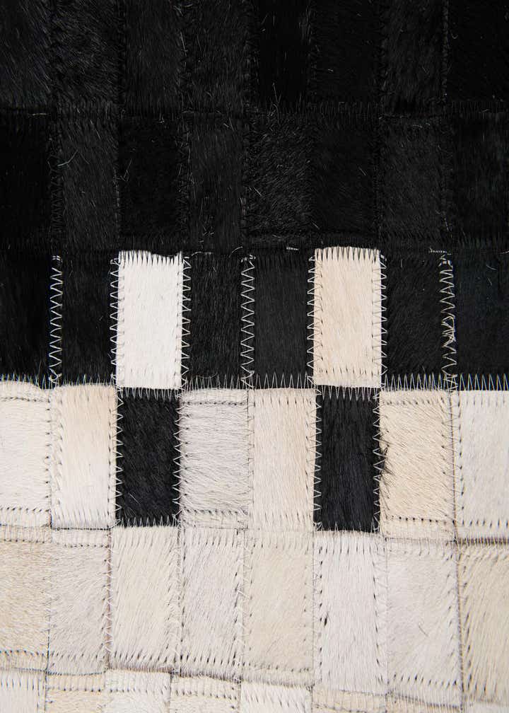 5' 2 x 8' 1 Cowhide Stocks Rug