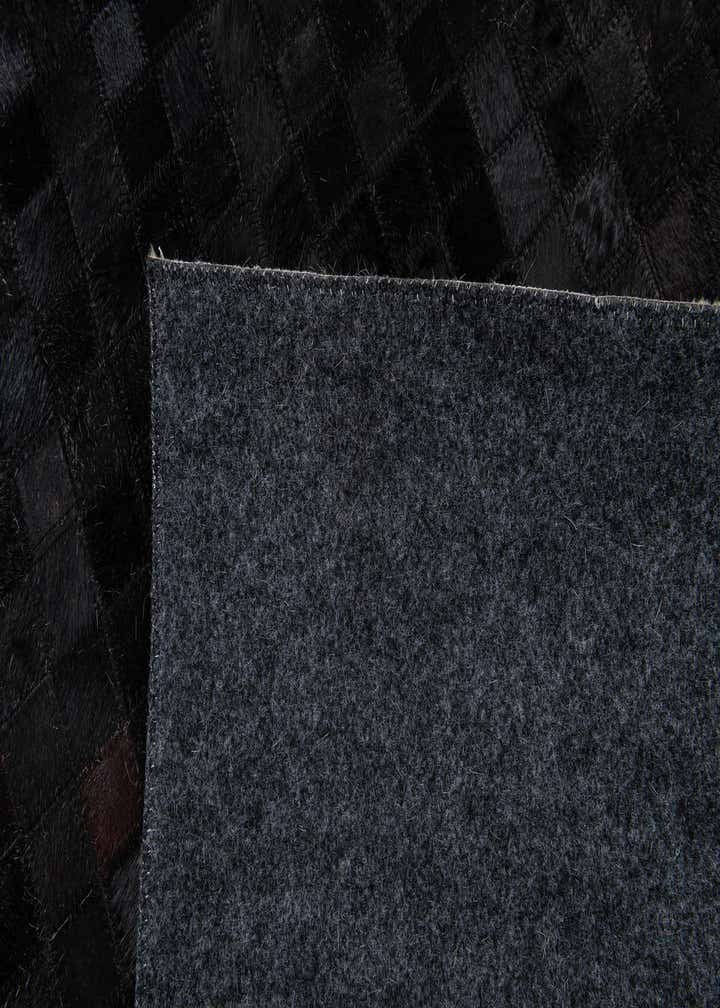 5' 2 x 8' 1 Cowhide Stocks Rug