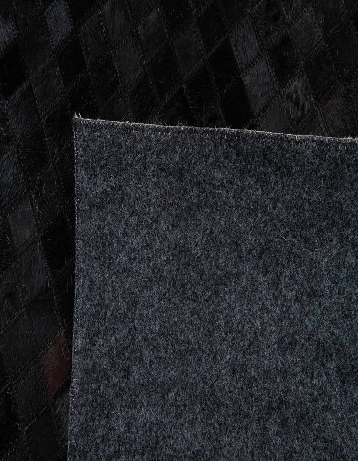 Detail image of 5' 2 x 8' 1 Cowhide Stocks Rug