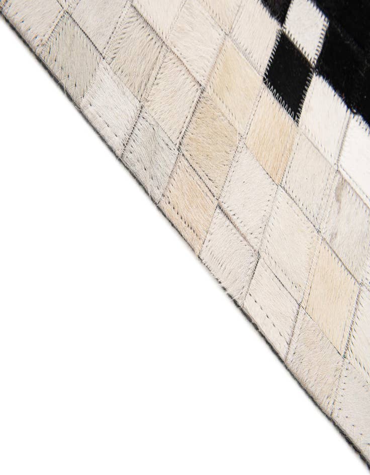 Detail image of 5' 2 x 8' 1 Cowhide Stocks Rug