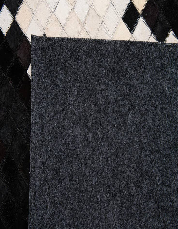 Detail image of 5' 2 x 8' 1 Cowhide Stocks Rug