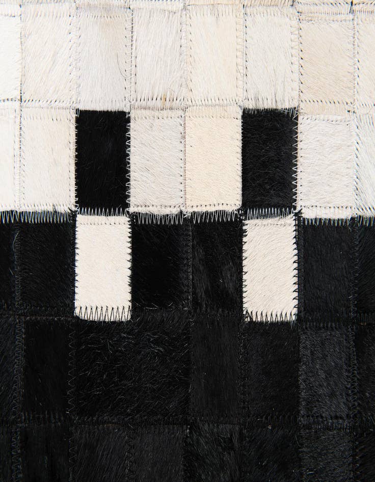 Detail image of 5' x 7' 9 Cowhide Stocks Rug