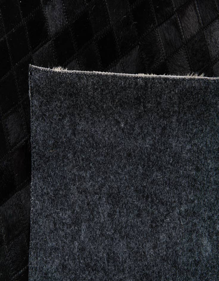 Detail image of 5' x 7' 9 Cowhide Stocks Rug