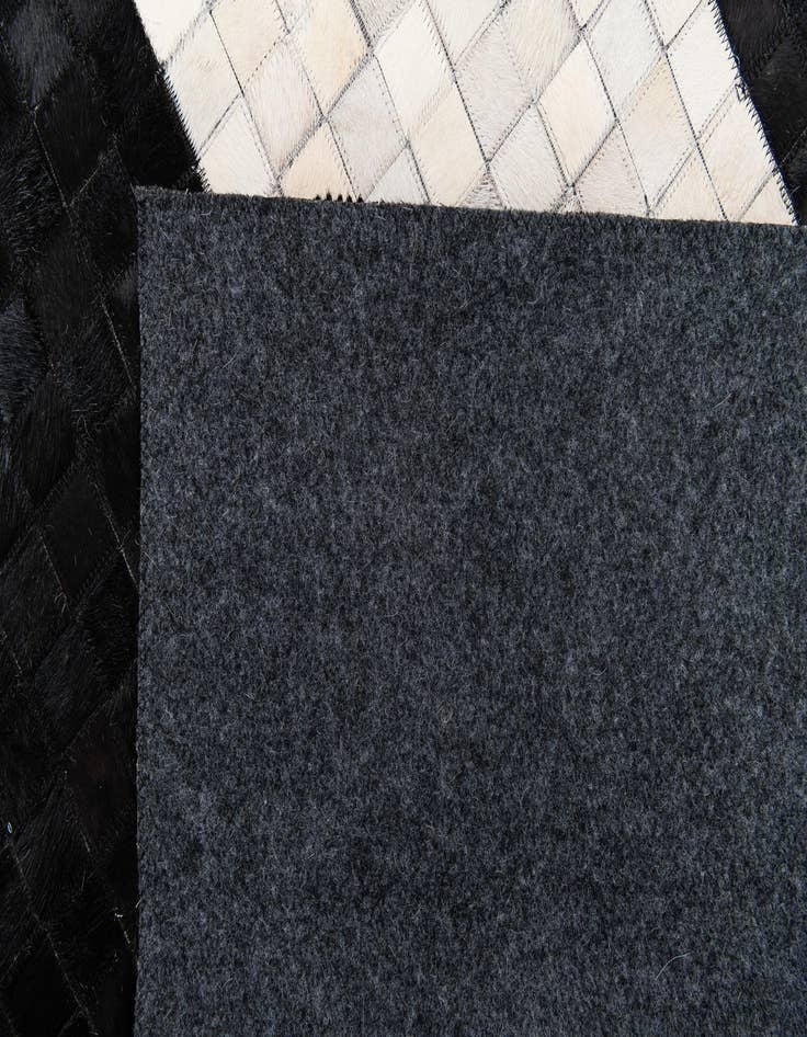 Detail image of 4' 11 x 7' 10 Cowhide Stocks Rug