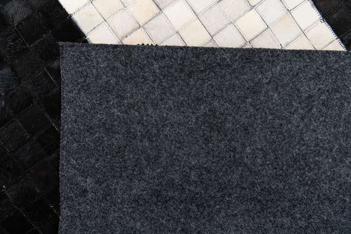 4' 11 x 7' 10 Cowhide Stocks Rug