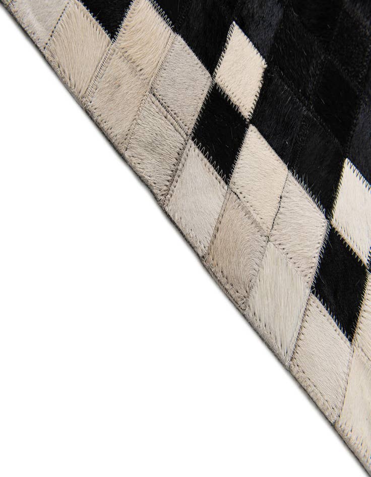 Detail image of 5' 2 x 8' Cowhide Stocks Rug