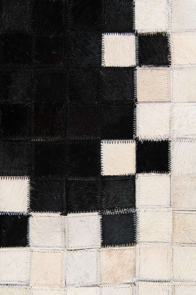 4' 11 x 7' 10 Cowhide Stocks Rug