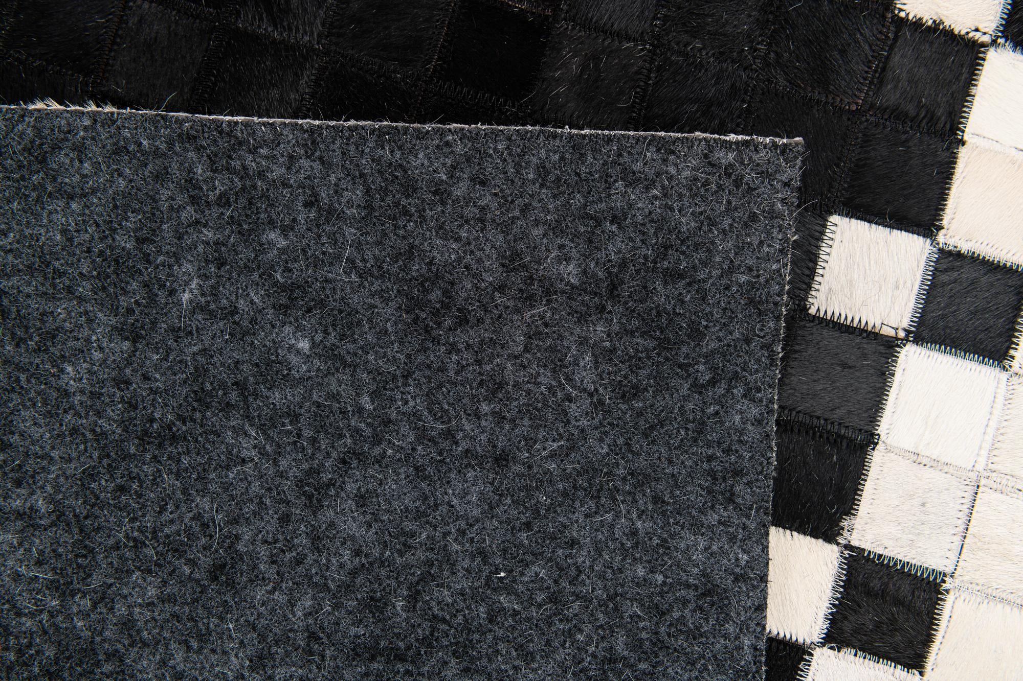 4' 11 x 7' 10 Cowhide Stocks Rug