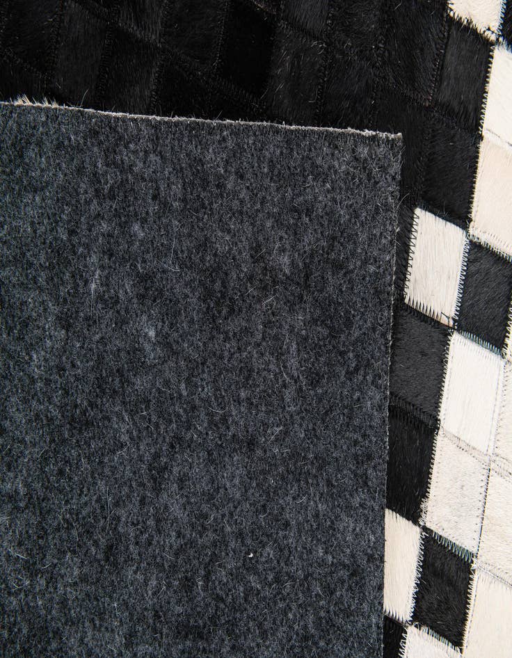 Detail image of 4' 11 x 7' 10 Cowhide Stocks Rug