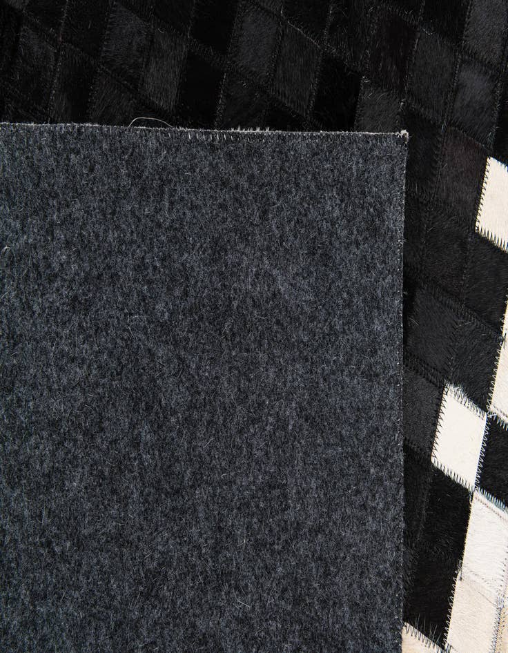 Detail image of 4' 10 x 7' 9 Cowhide Stocks Rug