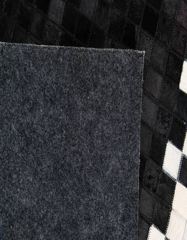 Detail image of 5' x 7' 10 Cowhide Stocks Rug