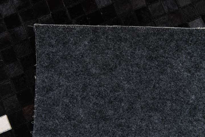 5' 1 x 7' 10 Cowhide Stocks Rug