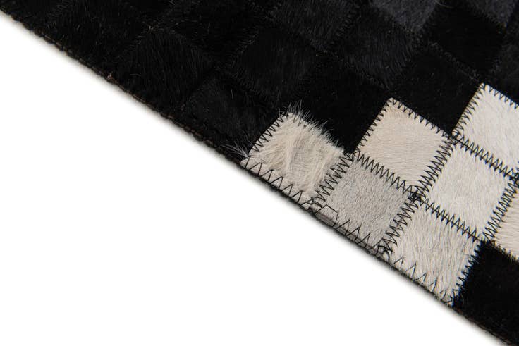 Detail image of 5' 2 x 8' Cowhide Stocks Rug