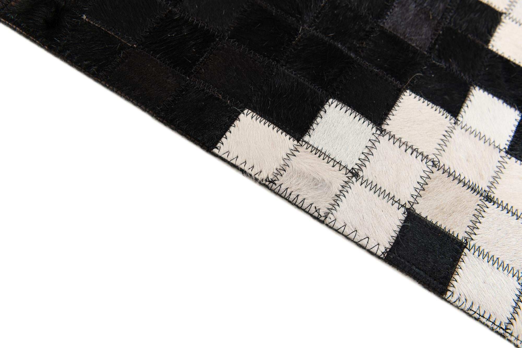 5' 2 x 8' 1 Cowhide Stocks Rug
