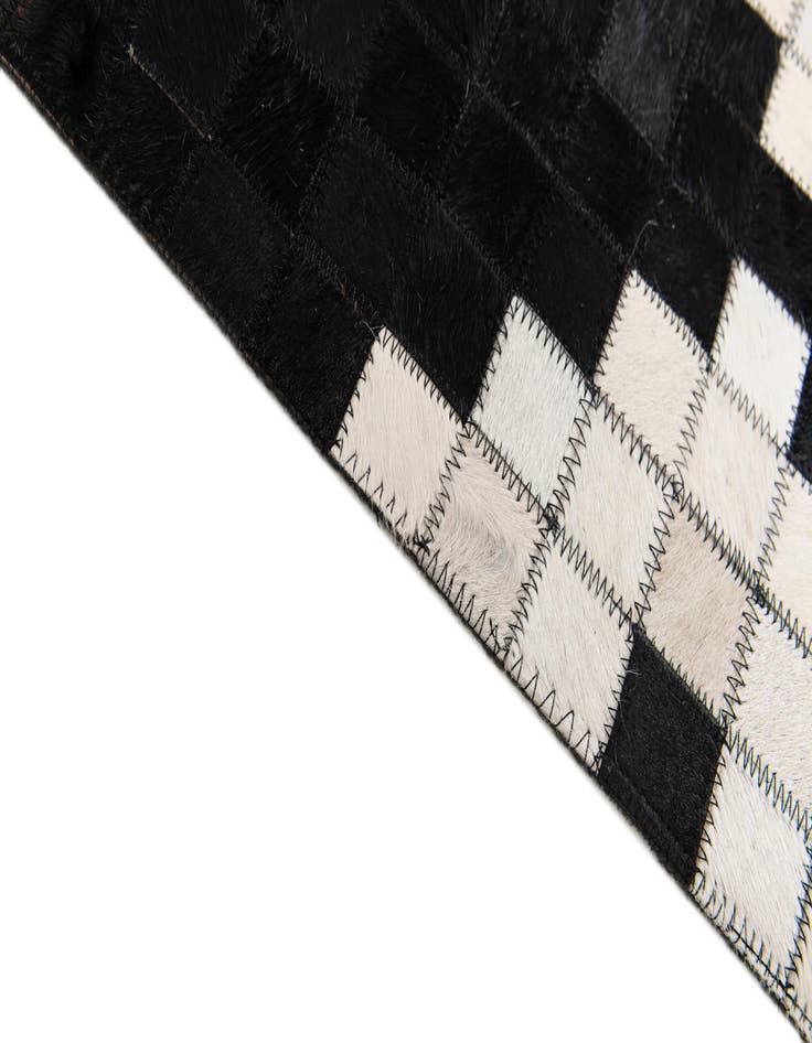 Detail image of 5' 2 x 8' 1 Cowhide Stocks Rug