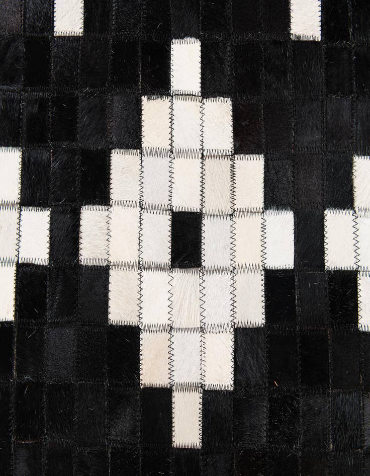 Detail image of 5' 2 x 8' 1 Cowhide Stocks Rug