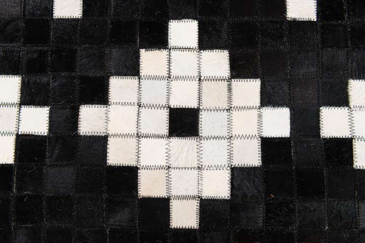 5' 2 x 8' 1 Cowhide Stocks Rug
