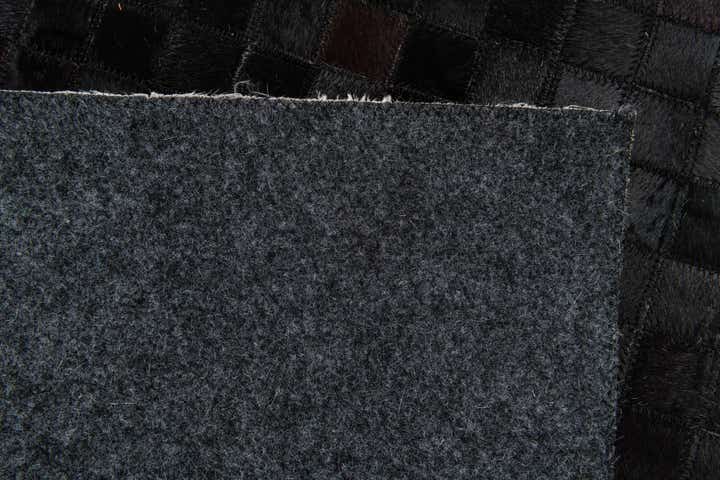 5' 2 x 8' 1 Cowhide Stocks Rug