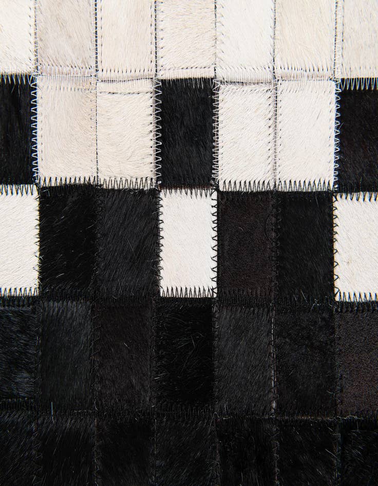 Detail image of 5' x 7' 11 Cowhide Stocks Rug